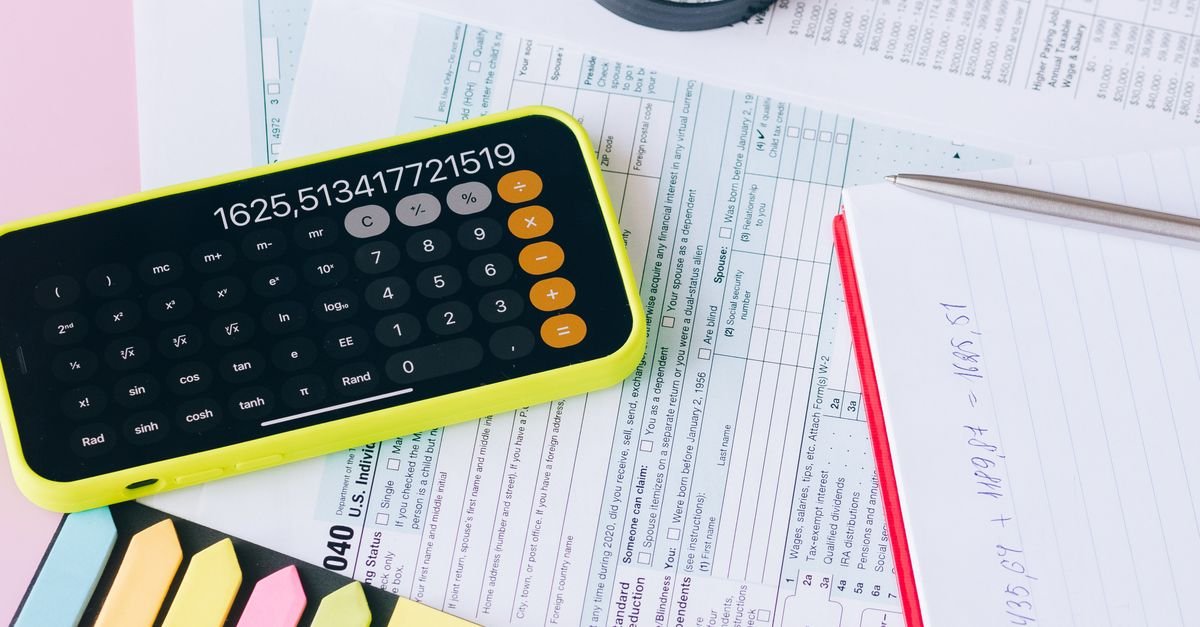 Person using a calculator to work out end-of-service benefit figures