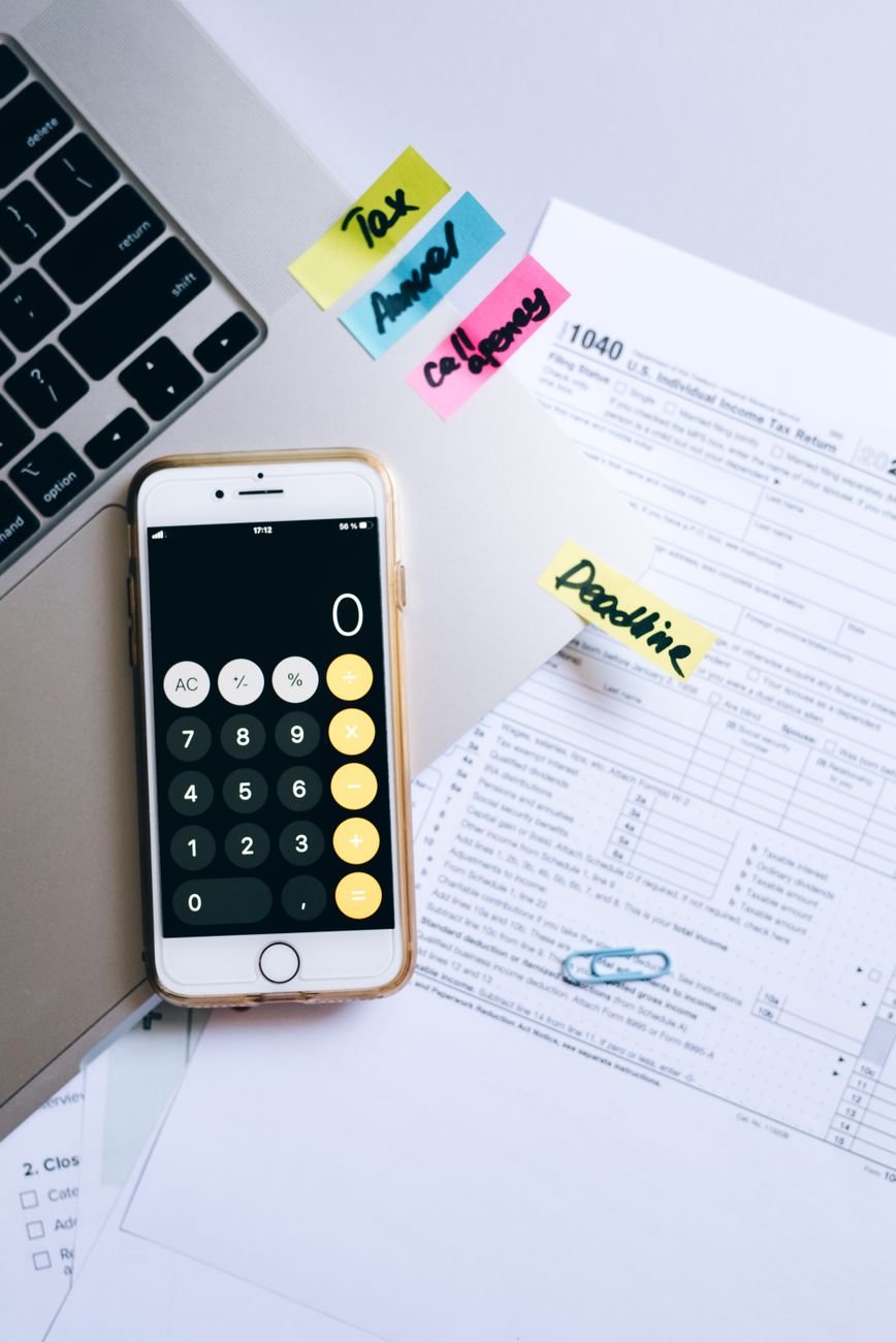 Financial documents and calculator on a desk