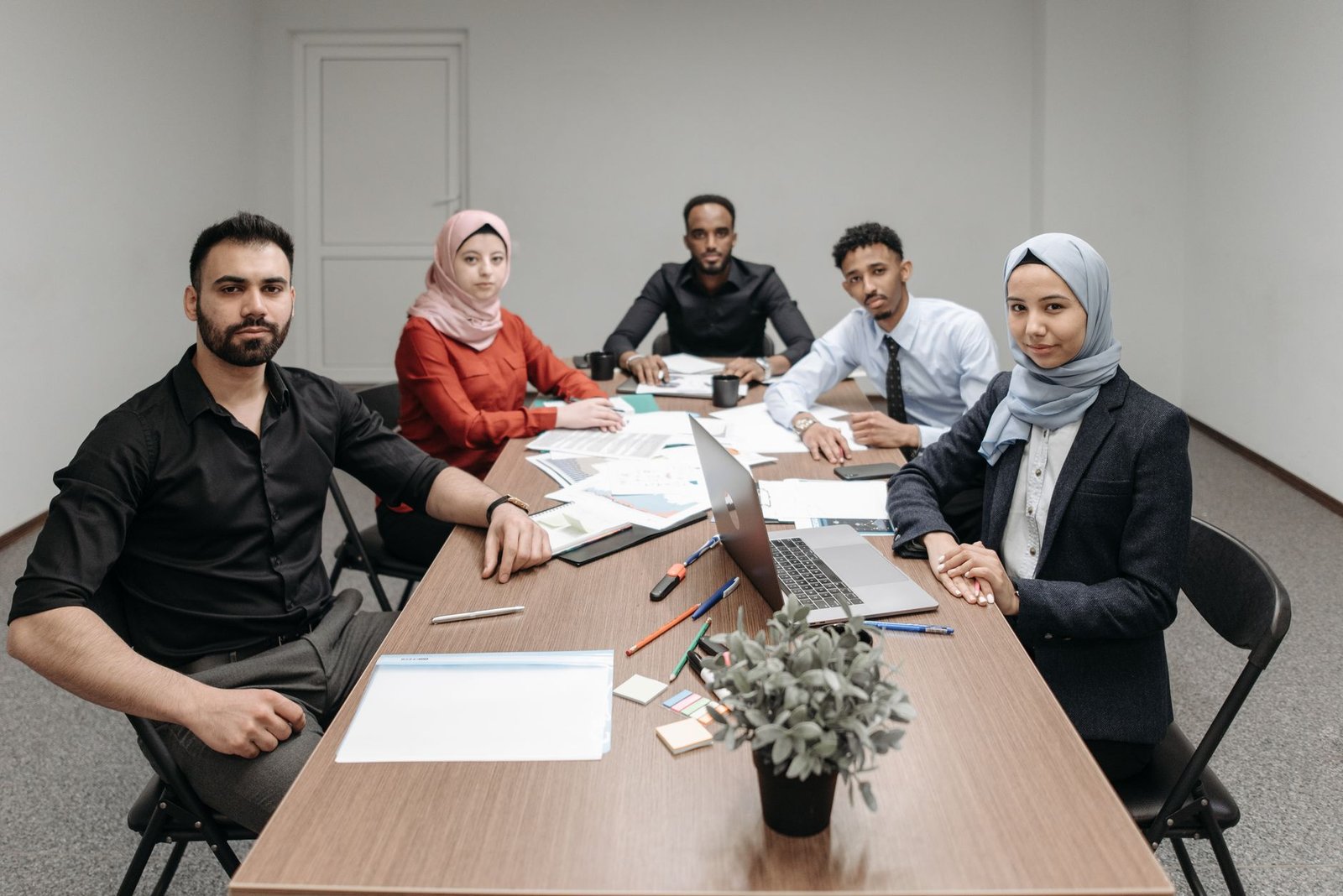 Diverse team of professionals in a Gulf office meeting